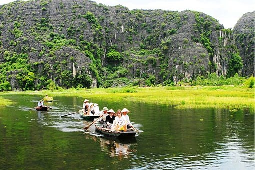 Foreigners Are Enjoying Their Boat Tours On The Tam Coc River